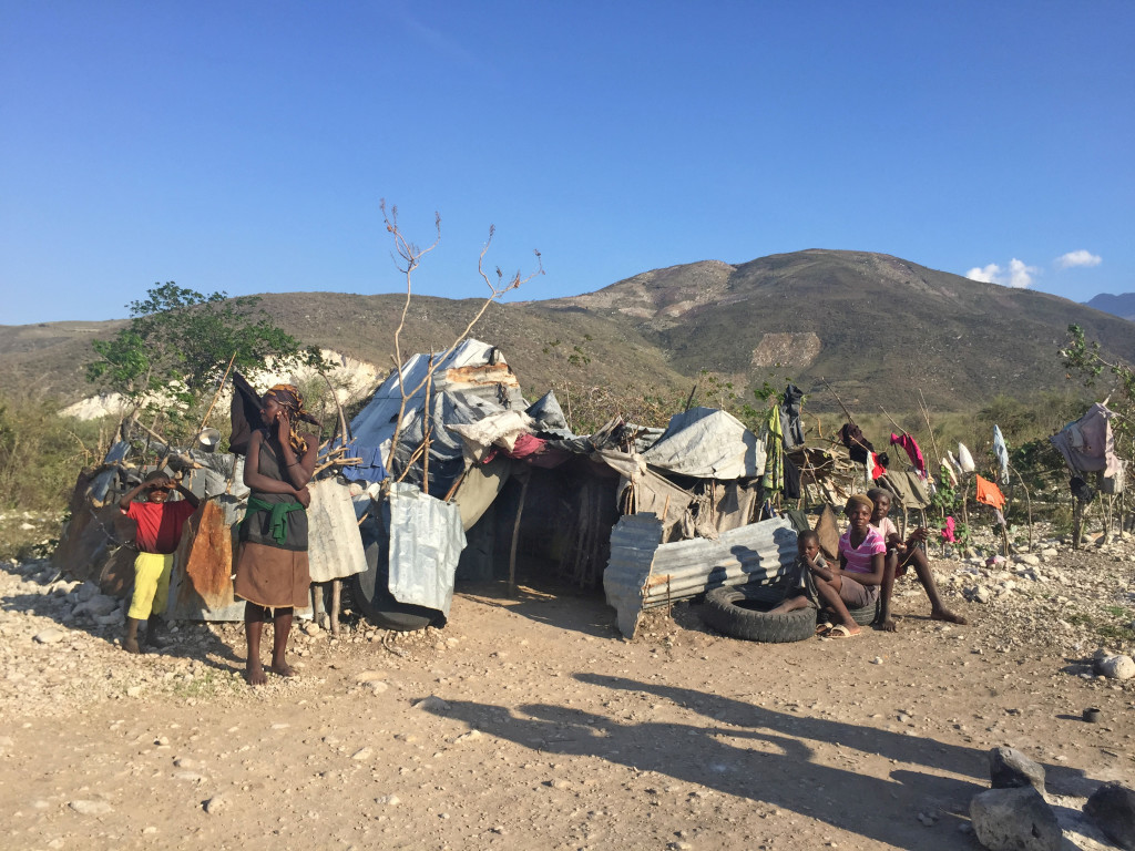 Madanm Zaniyis with some of her children in front of their home – it was laundry day. 